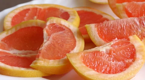 Panorama View Of Grapefruit Slices On The White Plate Stock Footage 62741669