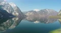 Panorama view of majestic high mountains, small village in green valley, travel 4k or 4k+ Resolution