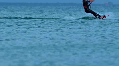 A panorama view of a surfer out on the open sea surfing with a parachute Video stock 253546813