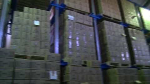 A panorama of a warehouse with racks on which boxes with goods stand. Stock Footage 149072647