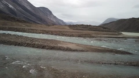 Panorama of wild river flowing to Summit lake in the remote arctic wilderness of Stock Footage 238849628
