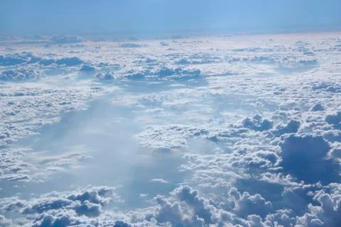 Panorama from window of plane with white clouds Stock Photos