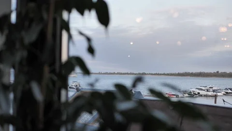 Panorama from the window on river along which ship sails background. Video stock 106191141