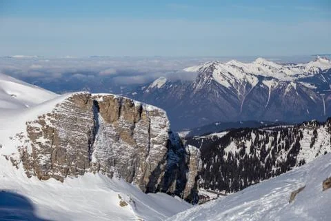 Panorama of winter Alps with low clouds Stock Photos