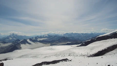 Panorama of winter mountains with clouds, Elbrus landscape Stock Footage 143680406