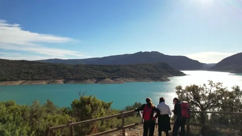 Panoramic aerial drone flight over tourists on edge Canyelles reservoir lake Video stock 236039151