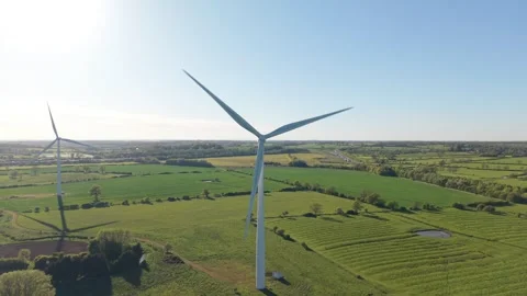 Panoramic aerial drone flight over wind turbines and countryside fields Stock-Footage 333935960