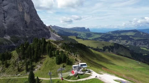 Panoramic aerial drone flight video over the mountain lift of Dolomites Alps. Stock Footage 313683520