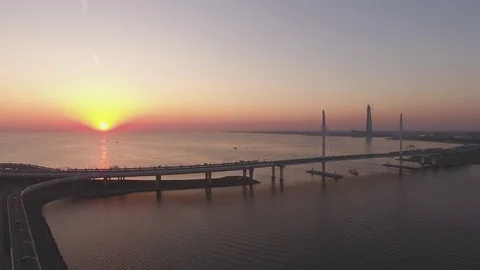 Panoramic aerial drone footage view of a suspension bridge across the Gulf of Fi Stock Footage 80600026