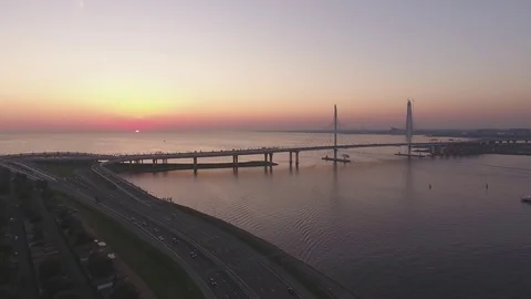 Panoramic aerial drone footage view of a suspension bridge across the Gulf of Fi Stock Footage 80602020