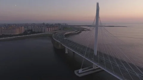 Panoramic aerial drone footage view of a suspension bridge across the Gulf of Fi Stock Footage 80602194