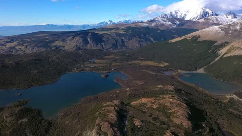Panoramic aerial drone view of blue aquamarine lakes, rivers, Andes mountains Stock Footage 105875226