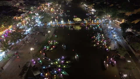 Panoramic aerial drone view of Hoi An Ancient town with boat tour in evening Stock-Footage 289259814