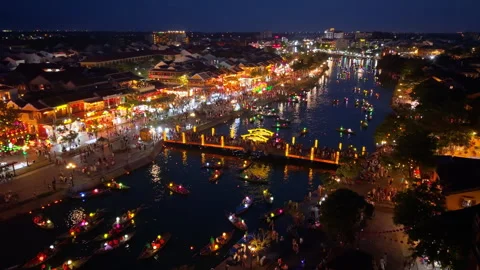 Panoramic aerial drone view of Hoi An Ancient town with boat tour in evening 스톡 동영상 308954986