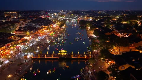 Panoramic aerial drone view of Hoi An Ancient town with boat tour in evening Stock-Footage 308955062