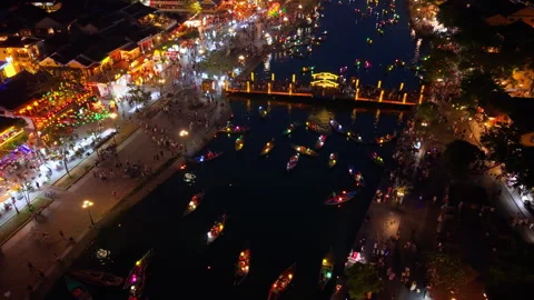 Panoramic aerial drone view of Hoi An Ancient town with boat tour in evening 스톡 동영상 308955158