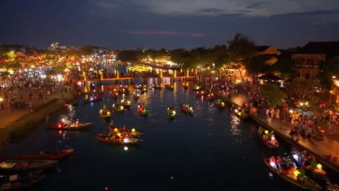Panoramic aerial drone view of Hoi An Ancient town with boat tour in evening Stock-Footage 308955192