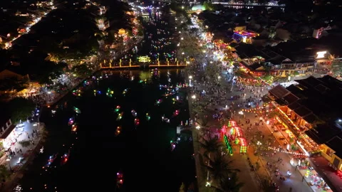 Panoramic aerial drone view of Hoi An Ancient town with boat tour in evening Video stock 308955866