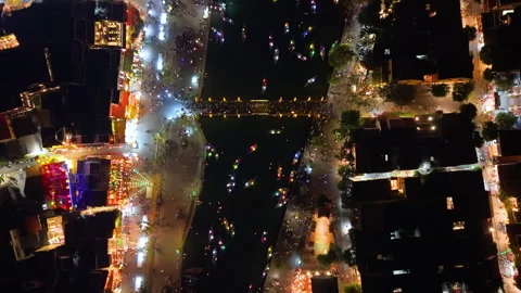 Panoramic aerial drone view of Hoi An Ancient town with boat tour in evening Video stock 308956530