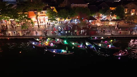 Panoramic aerial drone view of Hoi An Ancient town with boat tour in evening Stock-Footage 308957101