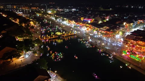 Panoramic aerial drone view of Hoi An Ancient town with boat tour in evening Stock-Footage 308958876