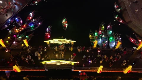 Panoramic aerial drone view of Hoi An Ancient town with boat tour in evening Video stock 308959178