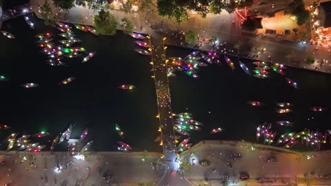 Panoramic aerial drone view of Hoi An Ancient town with boat tour in evening Stock Footage 308959275