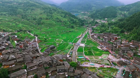 Panoramic Aerial Drone View of Xijiang Qianhu Miao Village and Rice Plantation Stock Footage 341741705