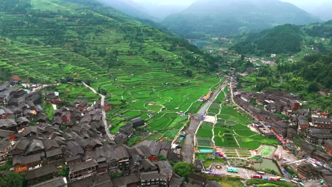 Panoramic Aerial Drone View of Xijiang Qianhu Miao Village and Rice Plantation Stock Footage 341743720