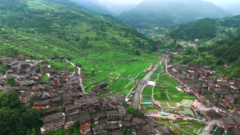 Panoramic Aerial Drone View of Xijiang Qianhu Miao Village and Rice Plantation Stock Footage 341743778