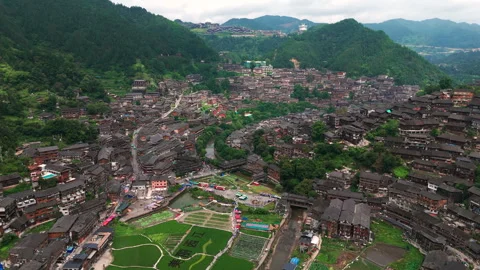 Panoramic Aerial Drone View of Xijiang Qianhu Miao Village and Rice Plantation Stock Footage 341750689