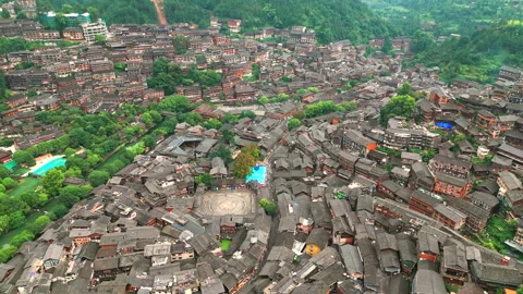 Panoramic Aerial Drone View of Xijiang Qianhu Miao Village and Rice Plantation Stock Footage 341752555