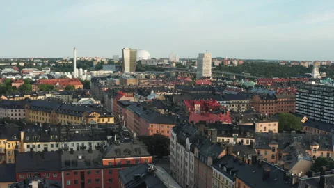 Panoramic aerial flying drone view of Södermalm black tin rooftops Video stock 150759489