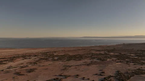 PANORAMIC AERIAL PULLBACK OF SALTON SEA IN CALIFORNIA AT SUNSET  (4K) - 15 OF 30 Stock Footage 330999058