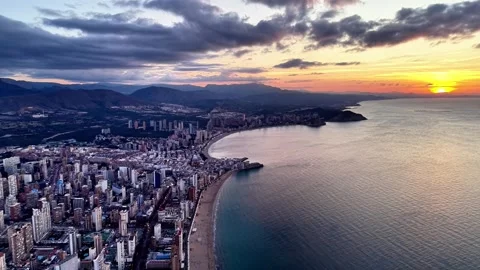Panoramic aerial shot of beach and mountains. Wide angle view of coast with Stock Footage 342361034