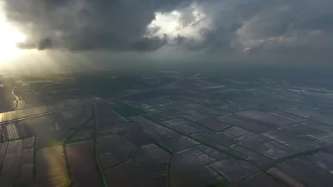 Panoramic aerial view of black storm clouds above flooded plains after heavy 動画素材 333776989