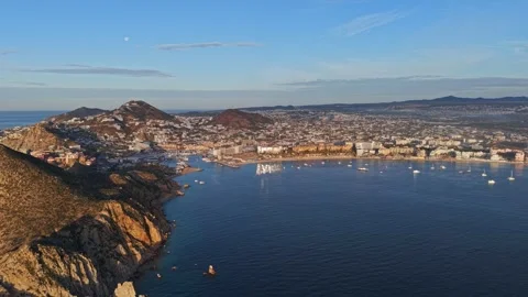 Panoramic aerial view of Cabo San Lucas Bay at sunset over the Sea of Cortez in Stock Footage 333263501