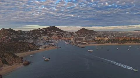 Panoramic aerial view of Cabo San Lucas Bay at sunset, with a blanket of clouds Stock Footage 333263683
