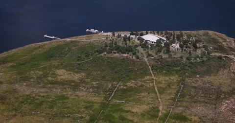 Panoramic aerial view of Calles Dam island with Cristo Roto sculpture, San José Stock Footage 319477137
