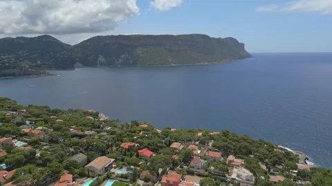 Panoramic aerial view of Cassis and the shimmering Mediterranean Sea Stock Footage 313384257