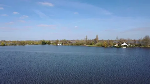 Panoramic aerial view of clouds and lake Stock Footage 152951745