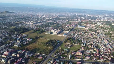 Panoramic Aerial View of a Developing City with Varied Architecture and Lus.. Stock Footage 314373107