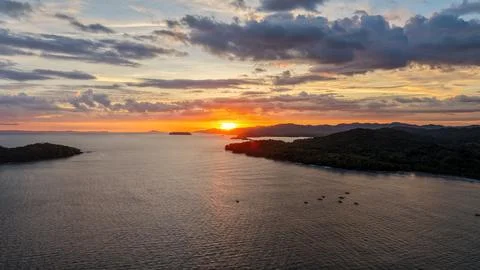 Panoramic aerial view of dramatic sunset over Pacific Ocean coastline in Sa.. Stock Photos