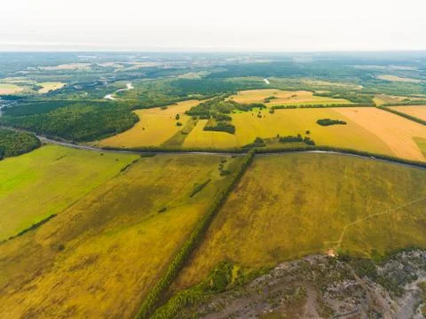 Panoramic aerial view of fields, road and river. Bird's-eye view of the land 写真素材