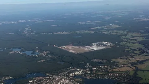 Panoramic aerial view - flying along area around Tesla Gigafactory 4 Stock Footage 342723200