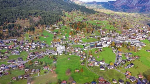 Panoramic aerial view of the Grindelwald valley and alpine village Stock Footage 335107839