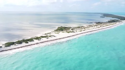 Panoramic aerial view of Isla Blanca beach with white sands and blue Stock Footage 259353118