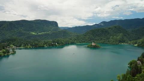 Panoramic aerial view of Lake Bled with its island, church and mountains Stock Footage 318547201