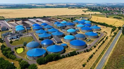 Panoramic Aerial View of Large Blue Dome Biogas Plant in Countryside Stock Photos