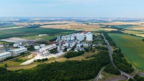 Panoramic Aerial View of Large Sugar Factory Surrounded by Fields Stock Photos